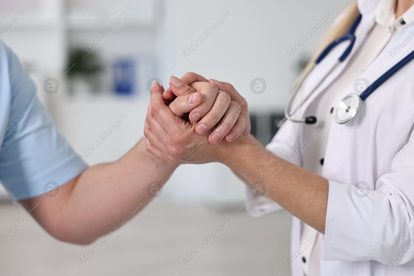 Photo of Professional doctor working with patient in hospital, closeup