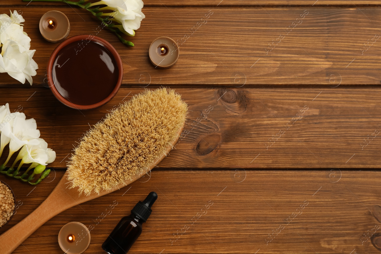 Photo of Flat lay composition with cosmetic products on wooden background, space for text. Spa body wraps