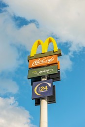 WARSAW, POLAND - SEPTEMBER 16, 2022: Signboard with McDonald's Restaurant logo against blue sky