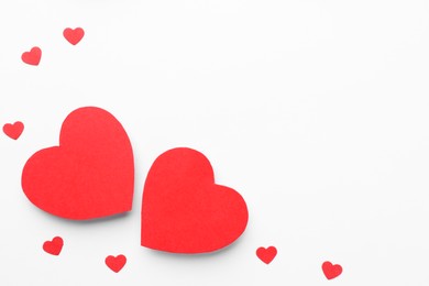 Photo of Paper hearts on white background, flat lay. Space for text