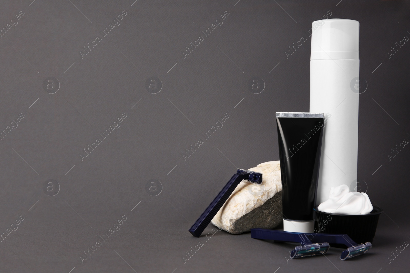 Photo of Different men's shaving accessories on grey background, space for text