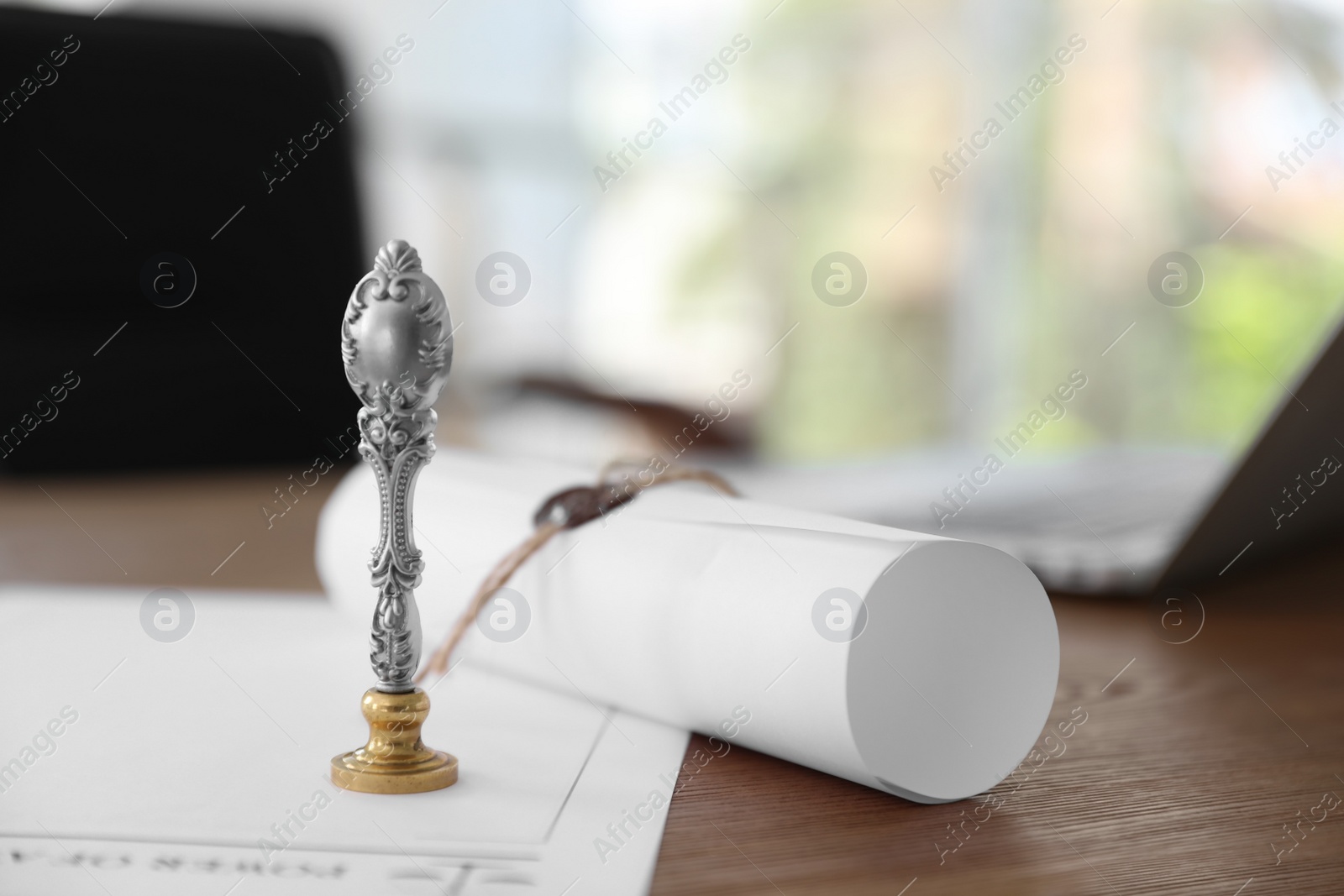 Photo of Vintage notary stamp and documents on desk, closeup