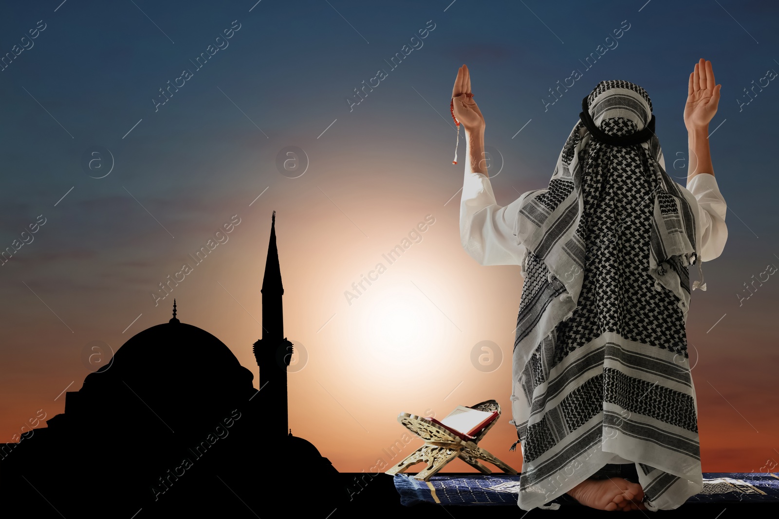 Image of Muslim man praying and silhouette of mosque on background