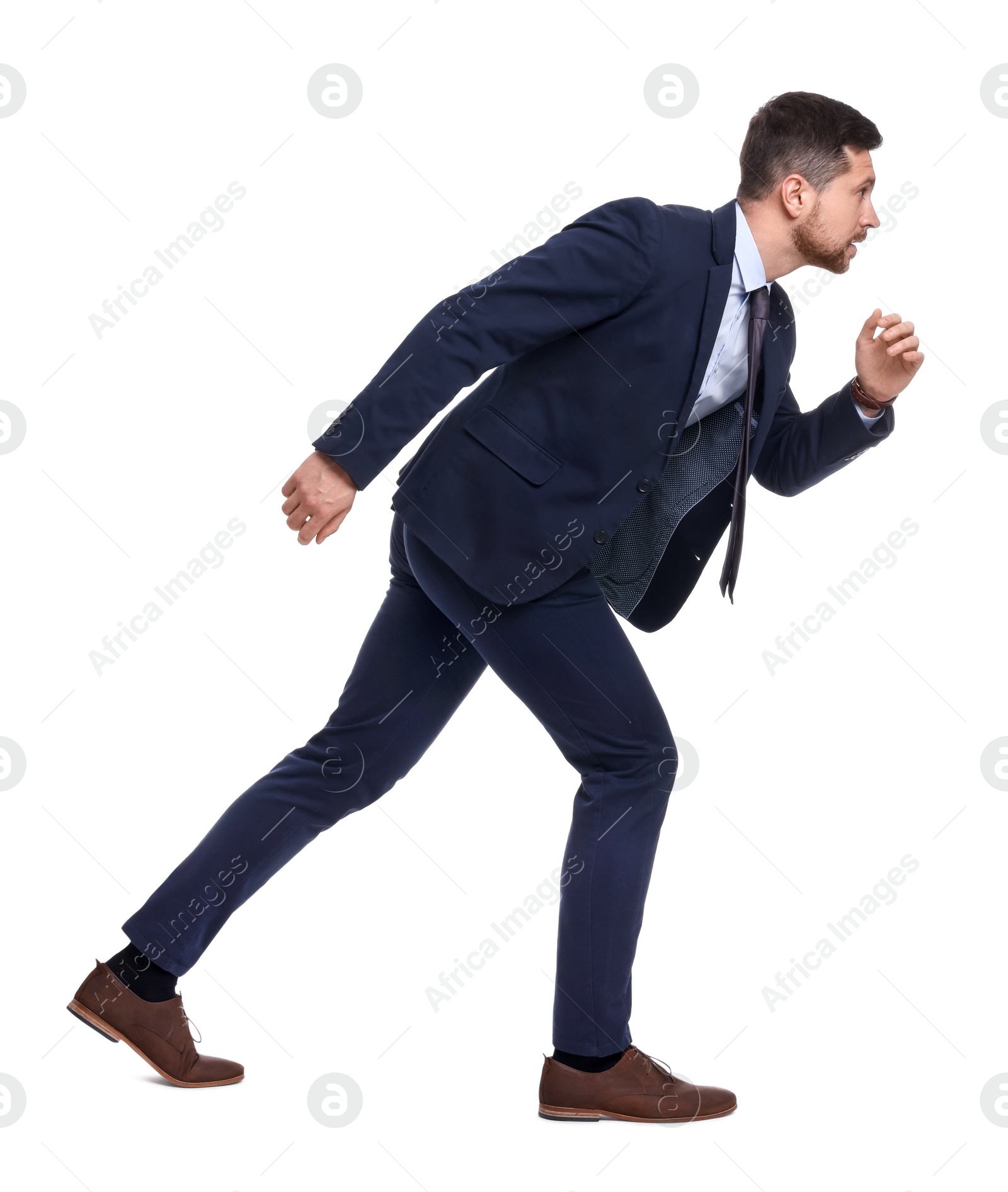 Photo of Handsome bearded businessman in suit running on white background