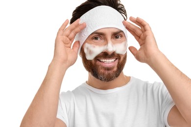 Photo of Man with headband washing his face on white background