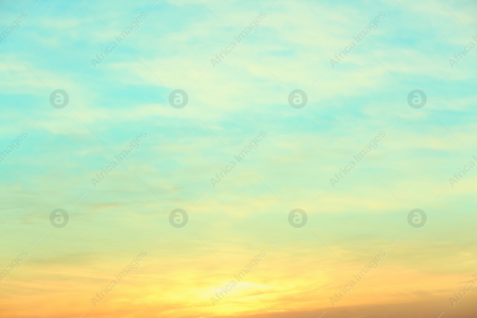 Photo of Picturesque view of beautiful sky lit by setting sun