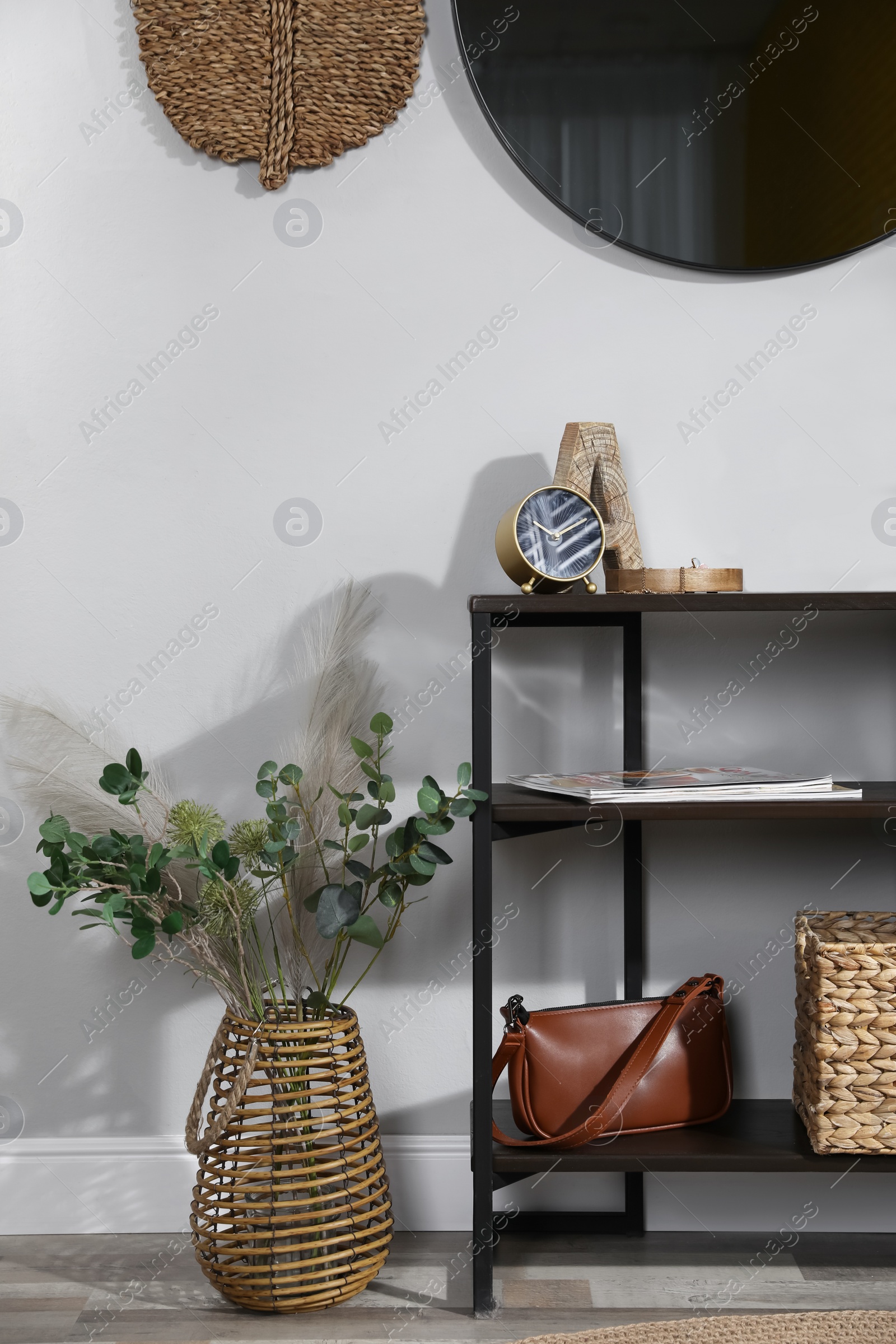 Photo of Stylish room interior with console table and beautiful decor elements