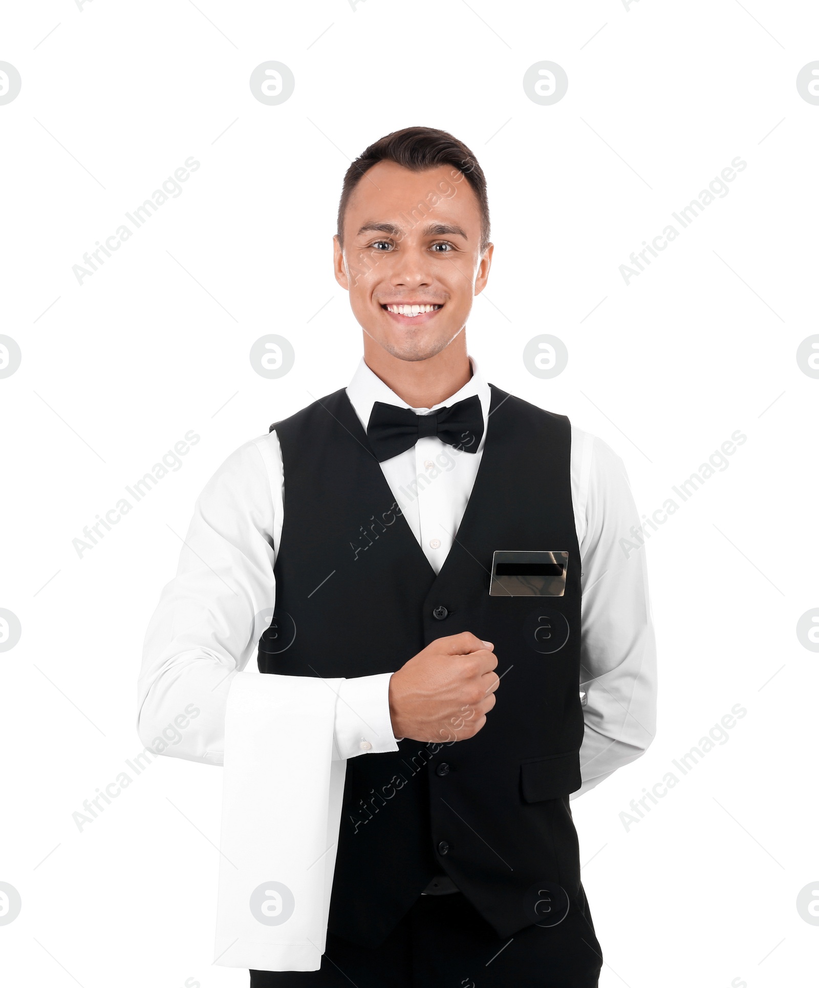 Photo of Portrait of young waiter in uniform on white background