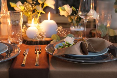 Photo of Elegant table setting with beautiful floral decor and burning candles