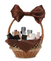 Photo of Cosmetic gift set in wicker basket isolated on white