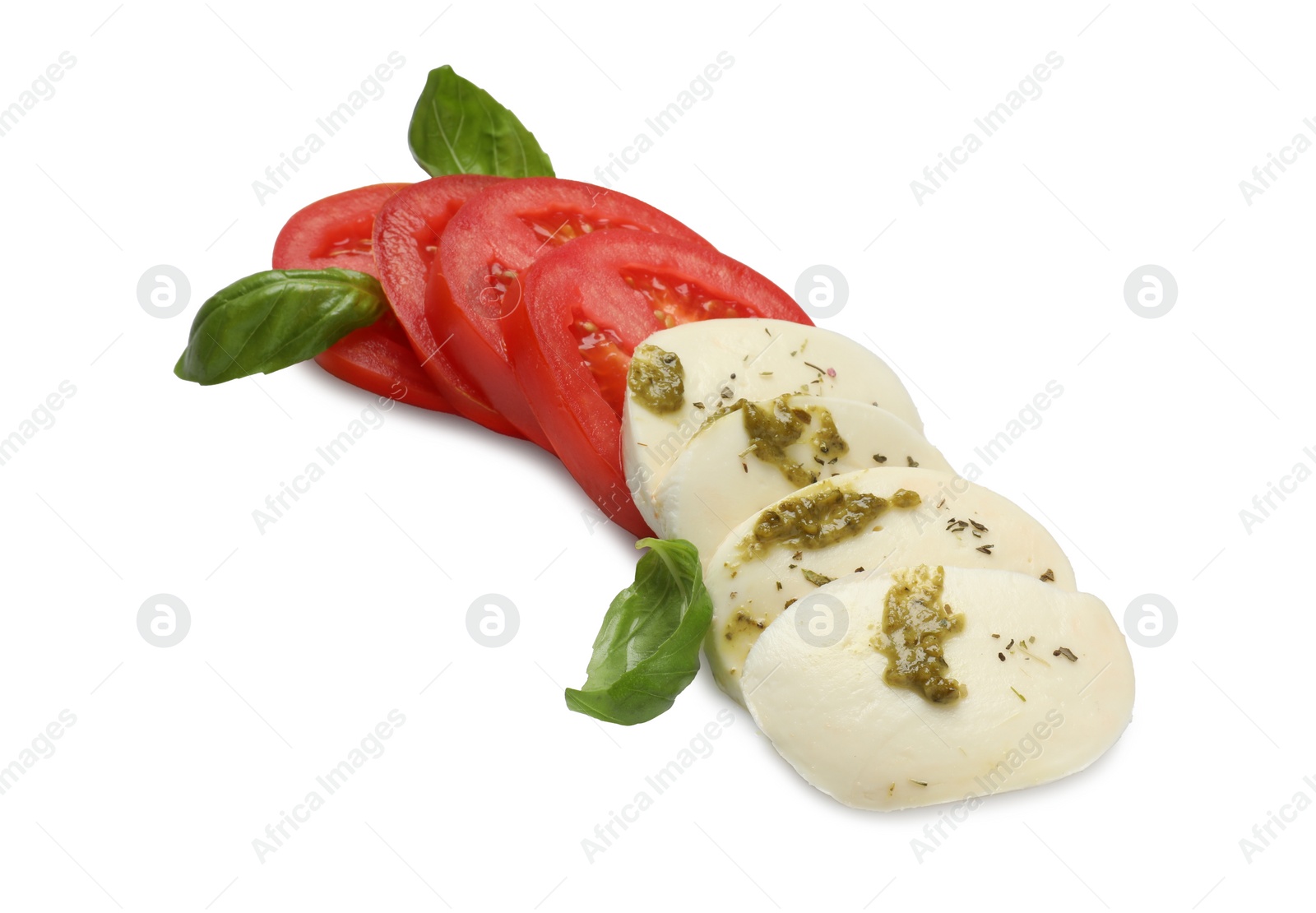 Photo of Tasty salad Caprese with mozzarella, tomatoes, basil and pesto sauce isolated on white