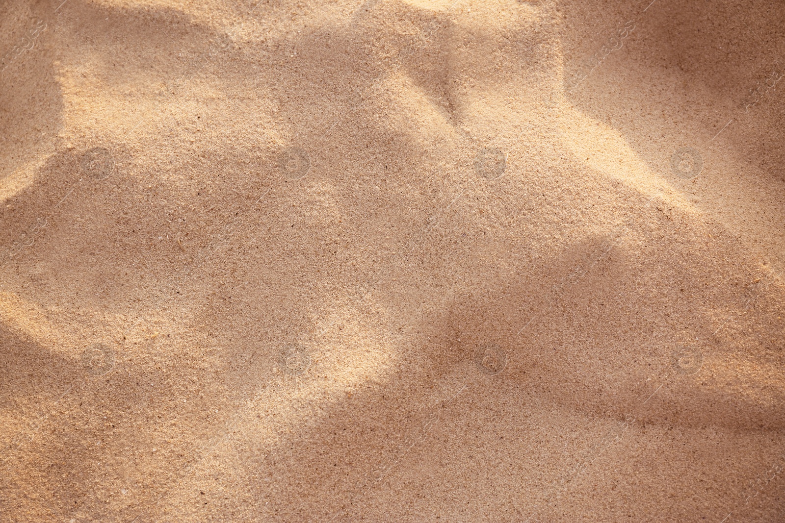 Photo of Beautiful view of golden beach sand as background