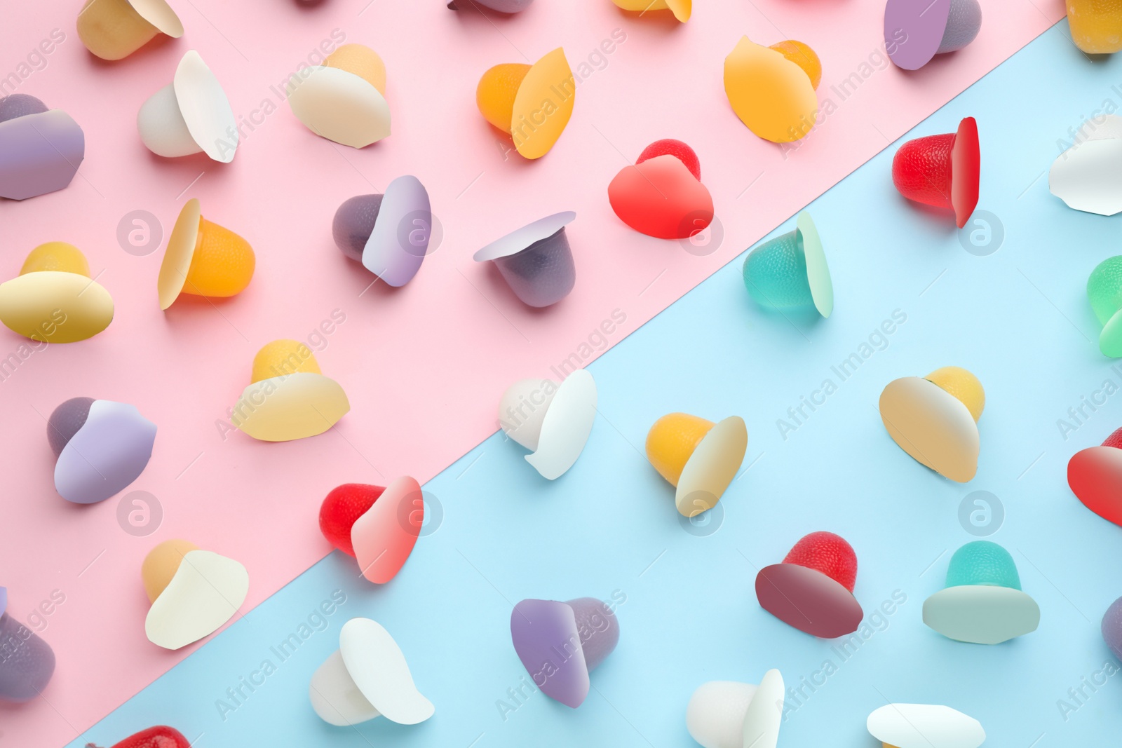 Photo of Tasty bright jelly cups on color background, flat lay