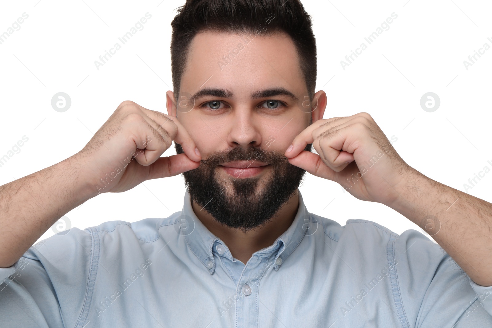 Photo of Happy young man touching mustache on white background