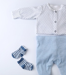 Photo of Flat lay composition with clothes for baby on white background