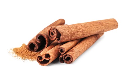 Photo of Dry aromatic cinnamon sticks and powder isolated on white