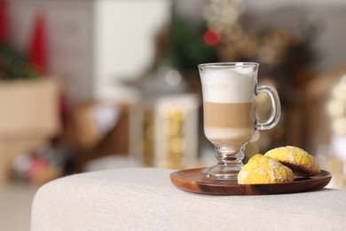 Aromatic latte macchiato in glass and cookies on white table against blurred background. Space for text