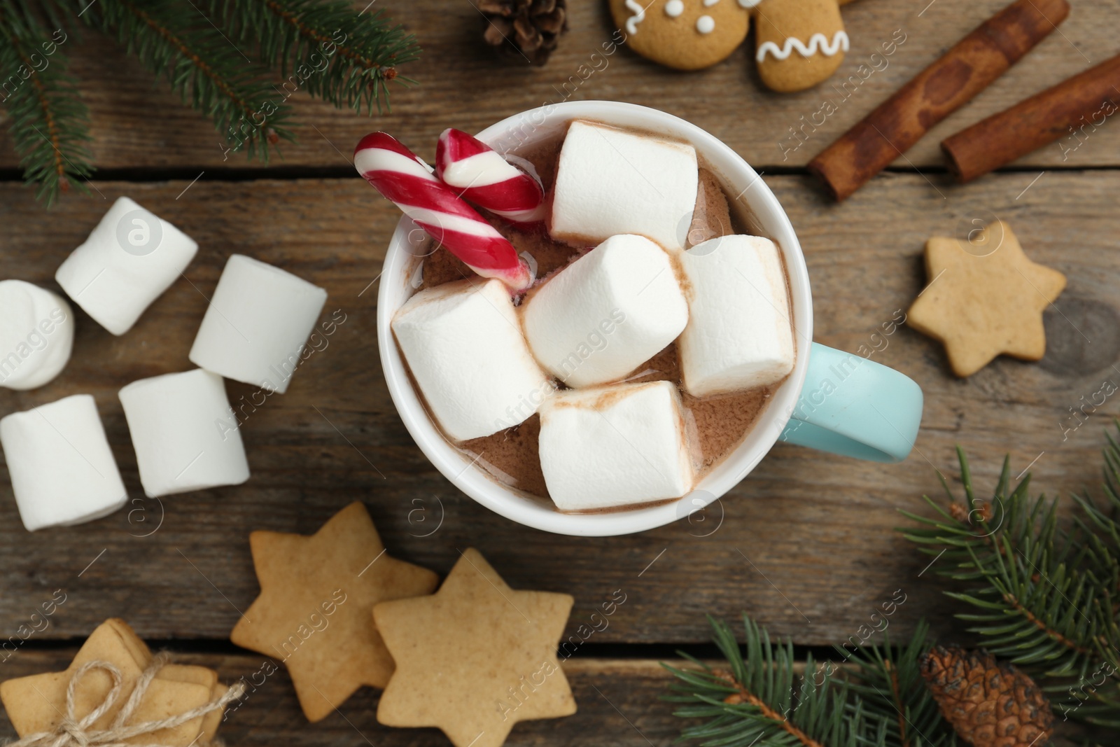 Photo of Flat lay composition with delicious marshmallow cocoa on wooden table