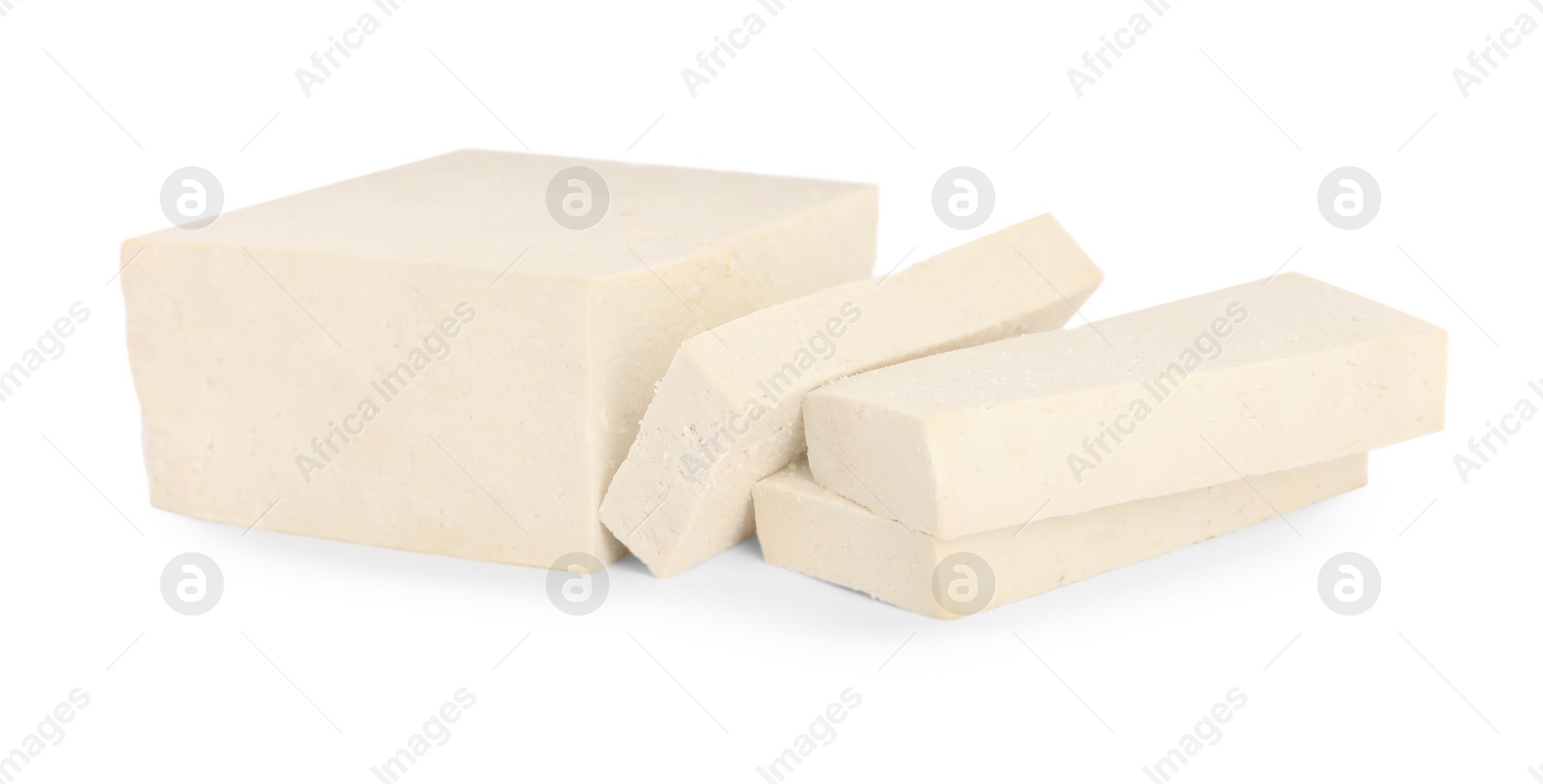 Photo of Cut raw tofu block on white background