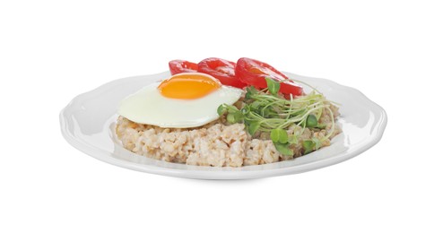 Photo of Delicious boiled oatmeal with fried egg, tomato and microgreens isolated on white