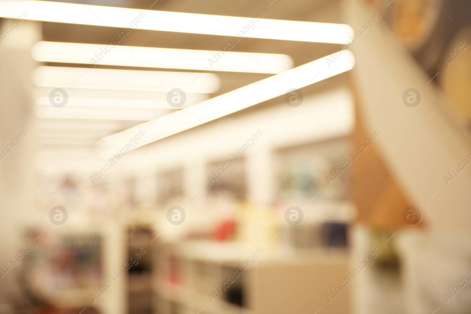 Photo of Blurred view of modern shopping mall interior