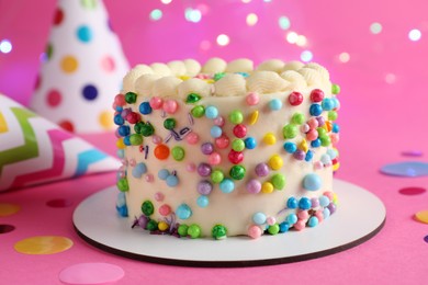 Photo of Cute bento cake with tasty cream and decor on pink background