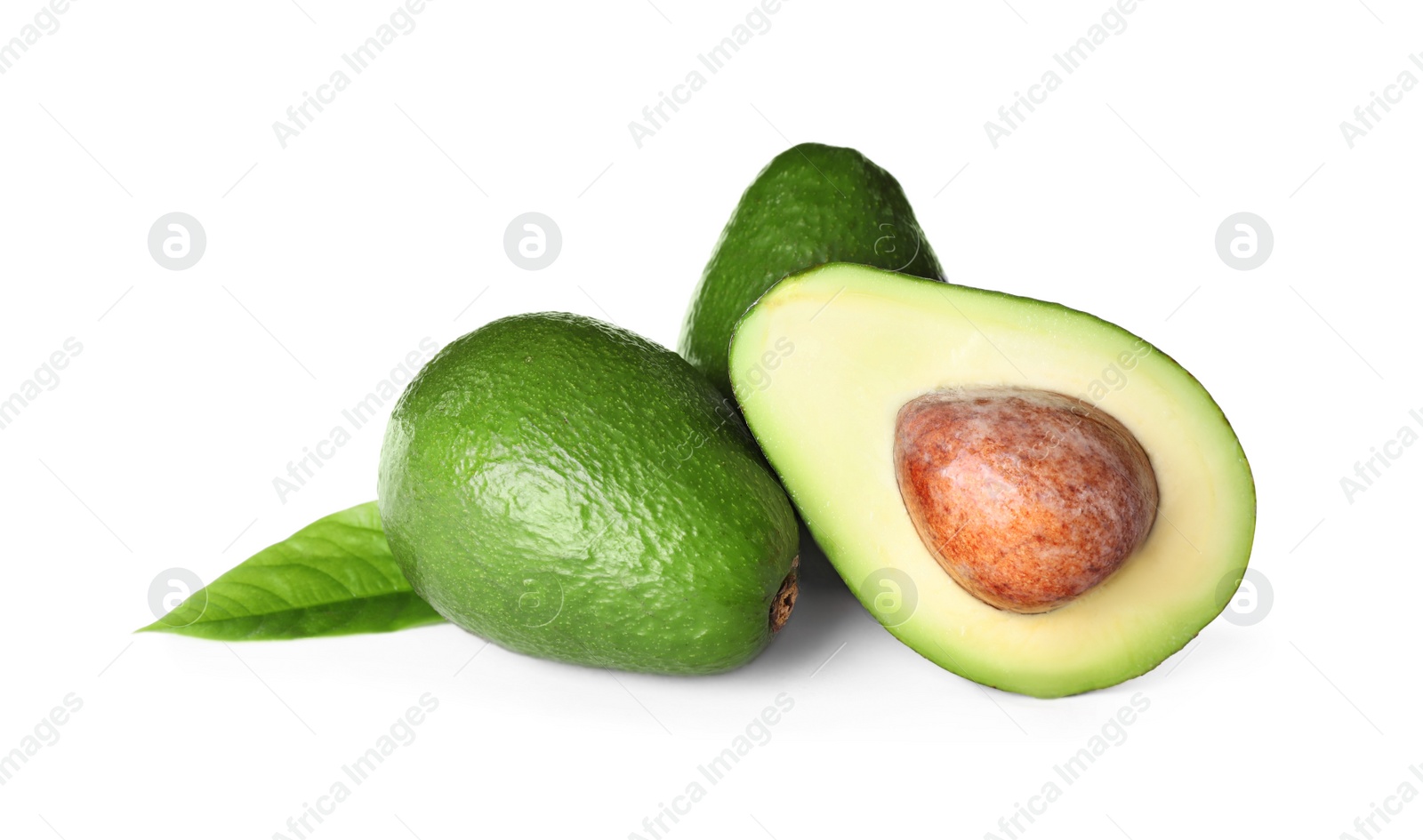 Photo of Whole and cut avocados isolated on white