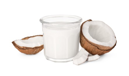 Photo of Glass of delicious vegan milk and coconut pieces on white background