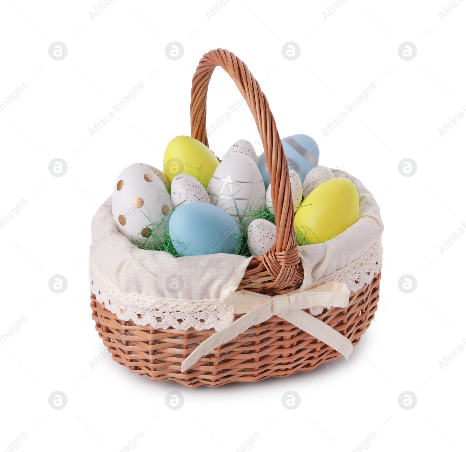 Photo of Wicker basket with beautifully painted Easter eggs isolated on white