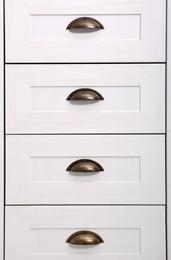 Photo of White wardrobe drawers as background, closeup view