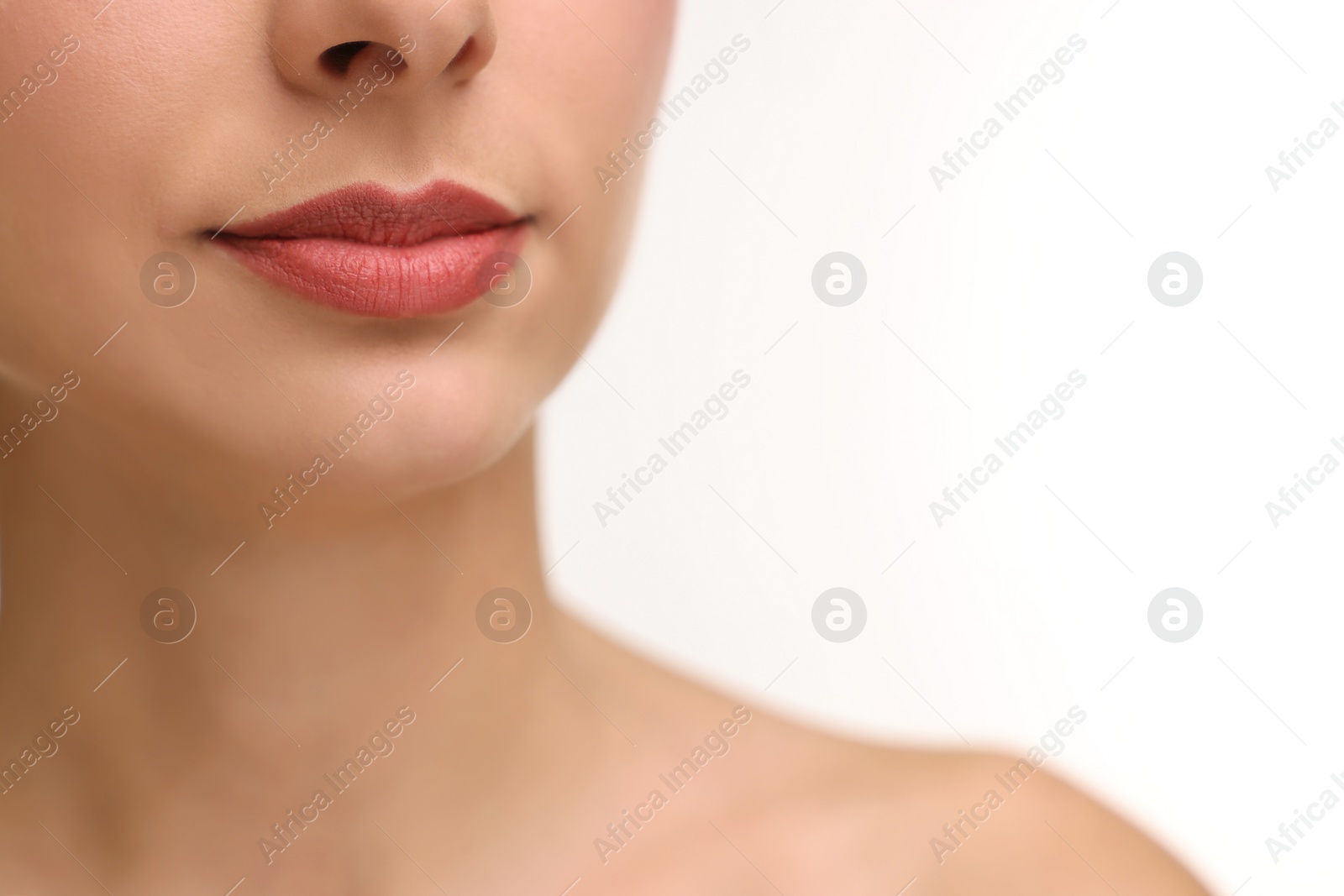 Photo of Woman with beautiful lips on white background, closeup. Space for text