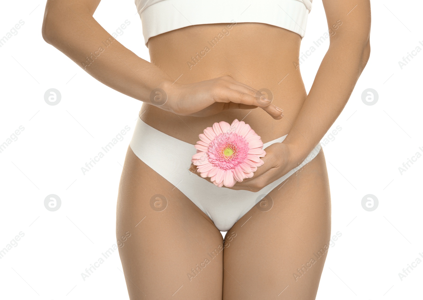 Photo of Gynecology. Woman in underwear with gerbera flower on white background, closeup