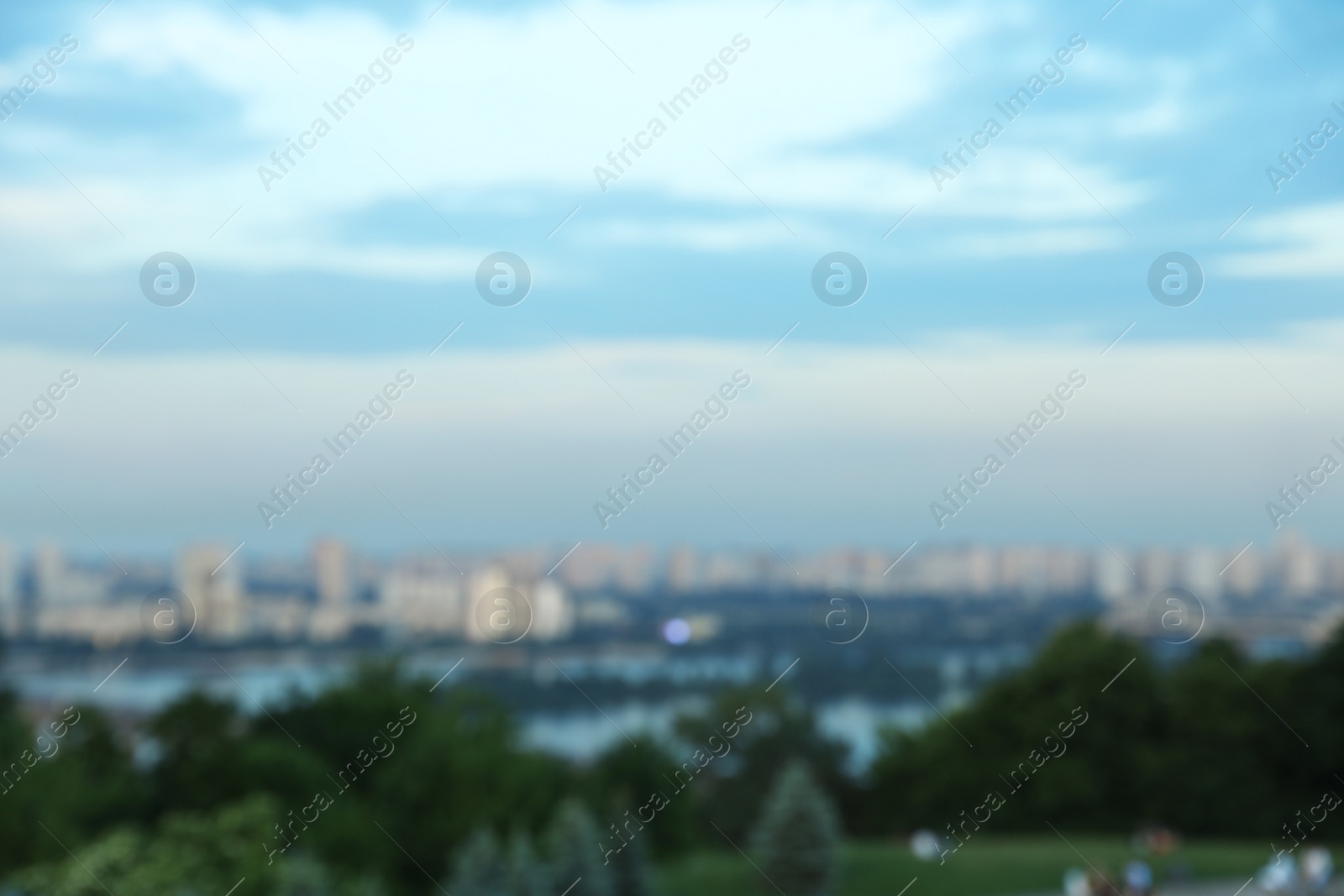 Photo of KYIV, UKRAINE - MAY 23, 2019: Beautiful cityscape with green park and Darnitsky railway bridge, bokeh effect