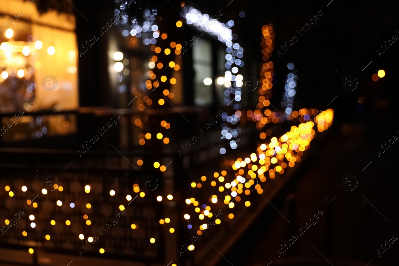 Photo of Beautiful street lights at night. Bokeh effect