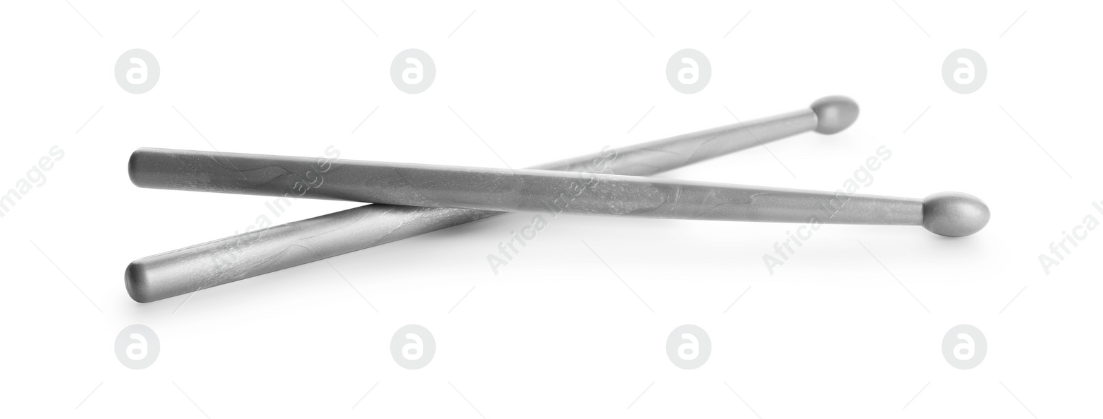 Photo of Two grey drum sticks isolated on white