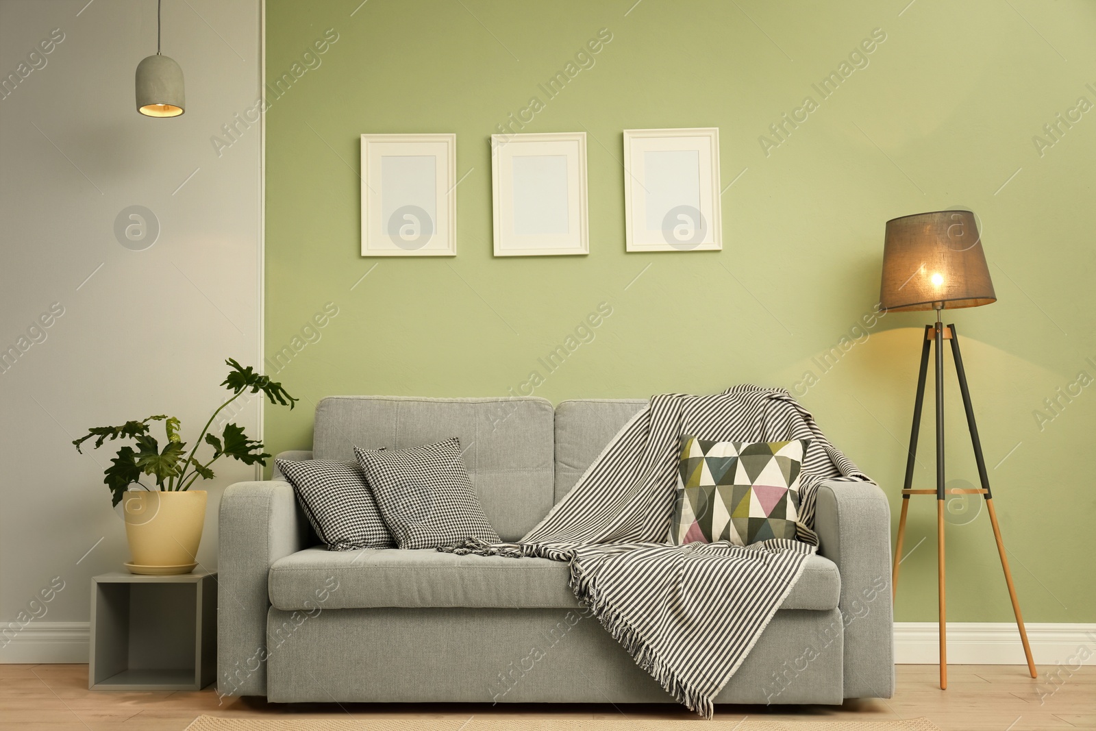 Photo of Stylish room interior with cozy sofa