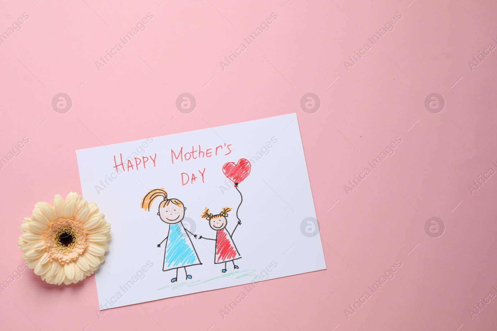 Photo of Drawing for Mother's day and flower on pastel pink background, flat lay