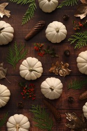 Photo of Flat lay composition with ripe white pumpkins on wooden table