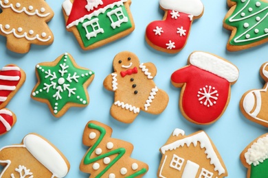 Photo of Flat lay composition with tasty homemade Christmas cookies on light blue background