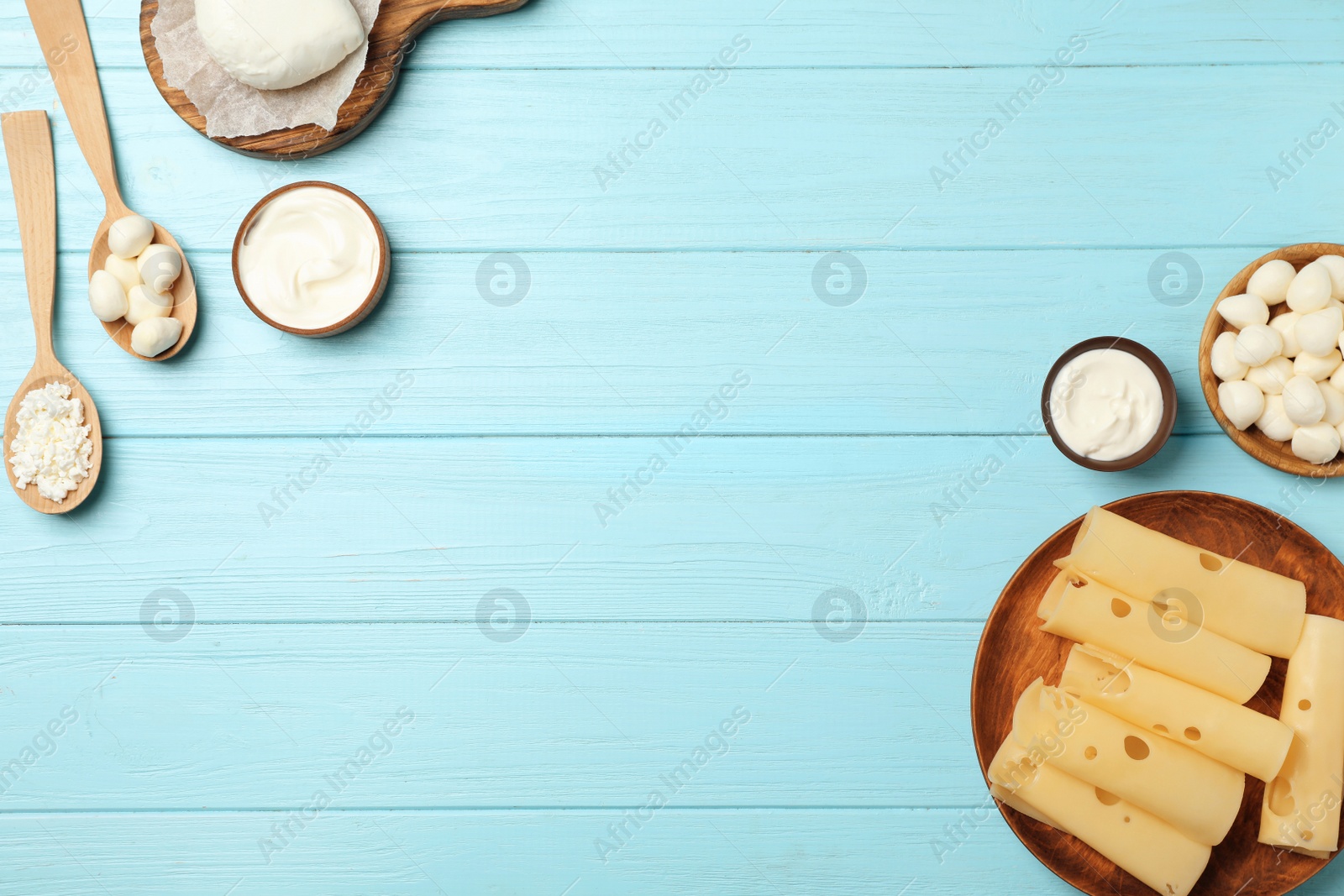 Photo of Flat lay composition with different dairy products on wooden background