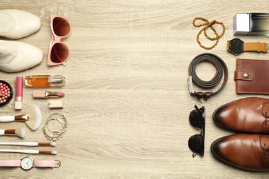 Photo of Fashionable male and female accessories on wooden background, flat lay. Space for text