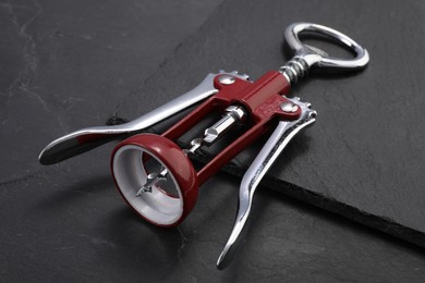 One wing corkscrew on grey textured table, closeup