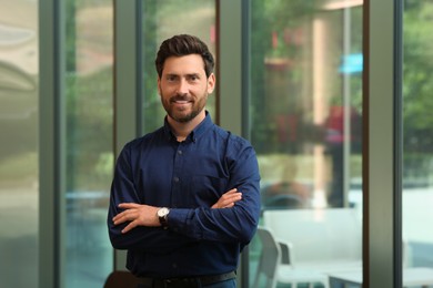 Portrait of handsome stylish man in office