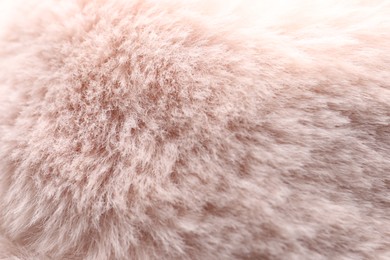 Texture of pink faux fur as background, closeup