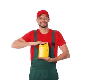 Photo of Man showing yellow container of motor oil on white background
