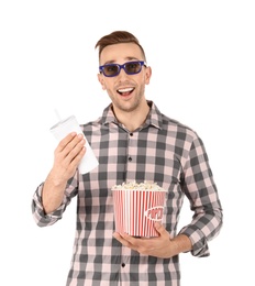 Man with 3D glasses, beverage and popcorn during cinema show on white background