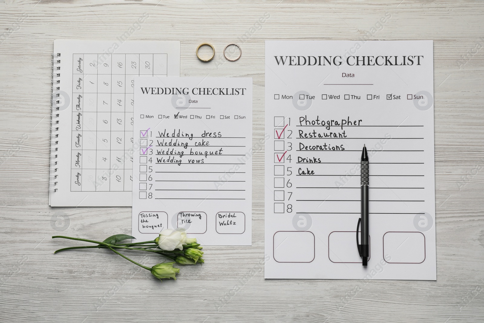 Photo of Flat lay composition with Wedding Checklists and calendar on white wooden table