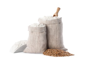 Photo of Sacks with flour and grains on white background