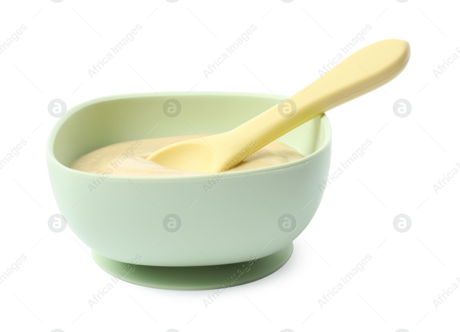 Photo of Tasty baby food and spoon in bowl isolated on white