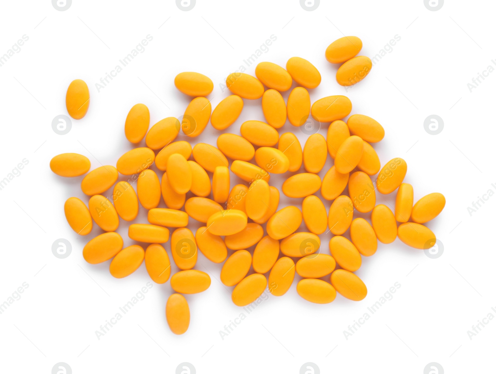 Photo of Tasty orange dragee candies on white background, top view